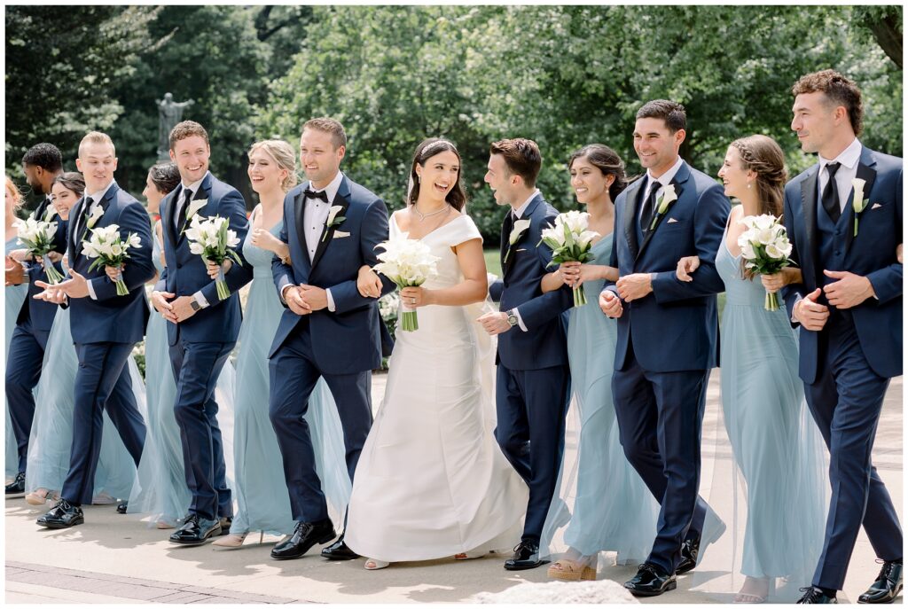 Bridal Party laughing and walking together