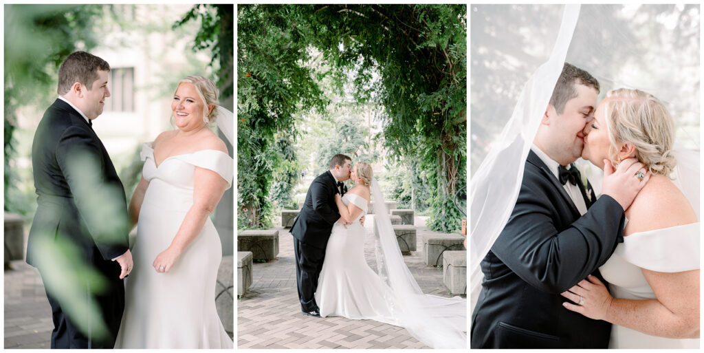 notre dame bride and groom kiss under greenery 