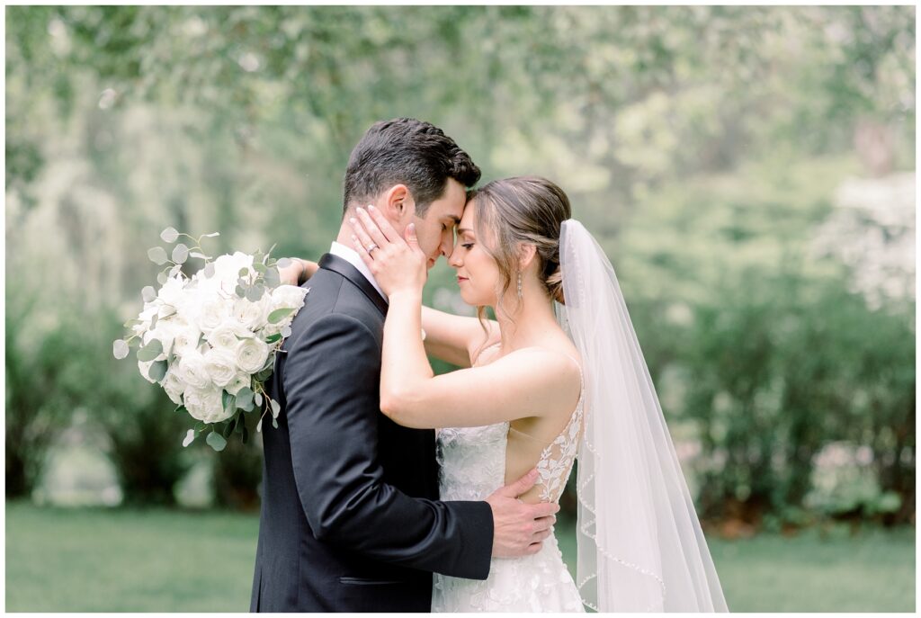 long beaded wedding veil, white bridal bouquet  