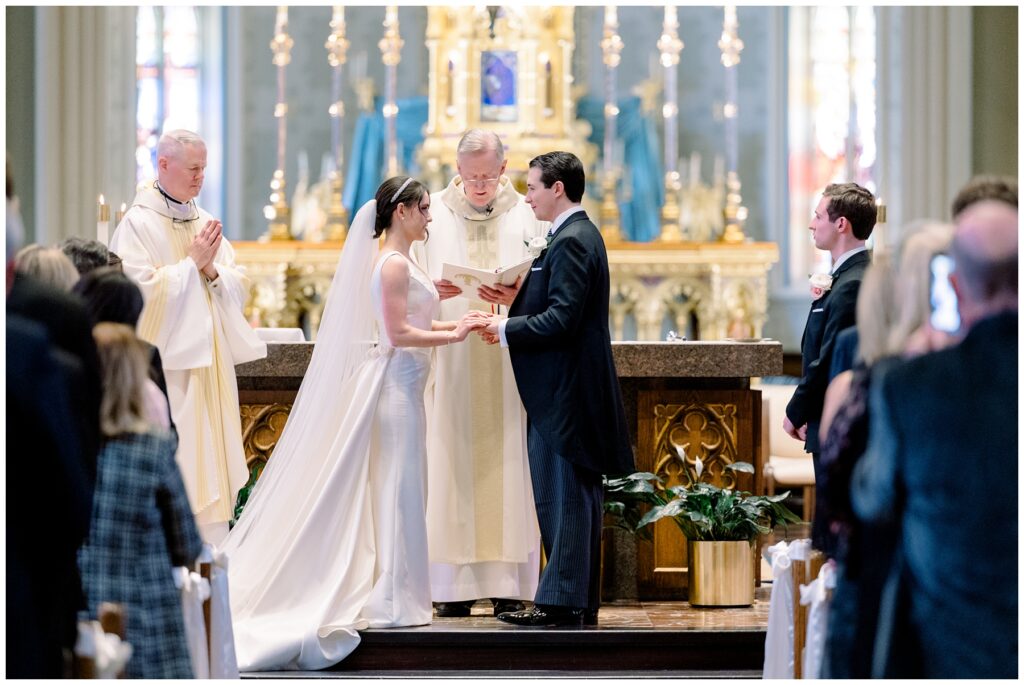Exchanging rings at Basilica Wedding