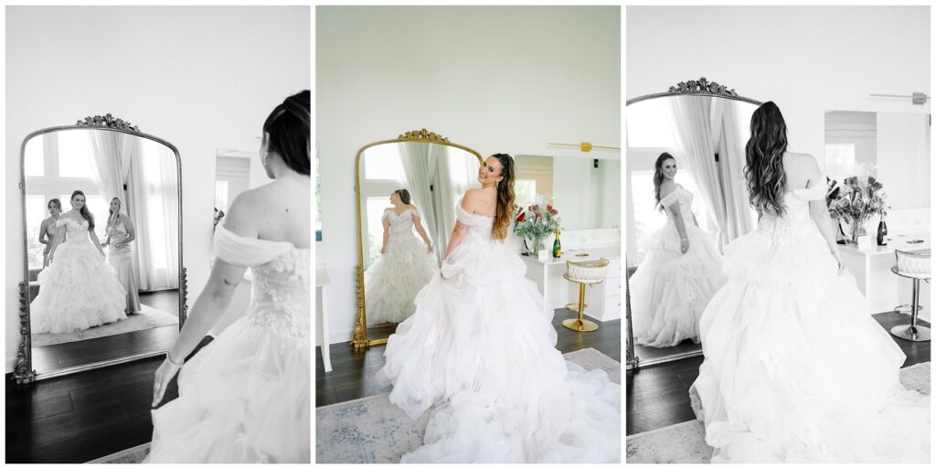 A bride stands in front of a mirror in her fairytale wedding gown.