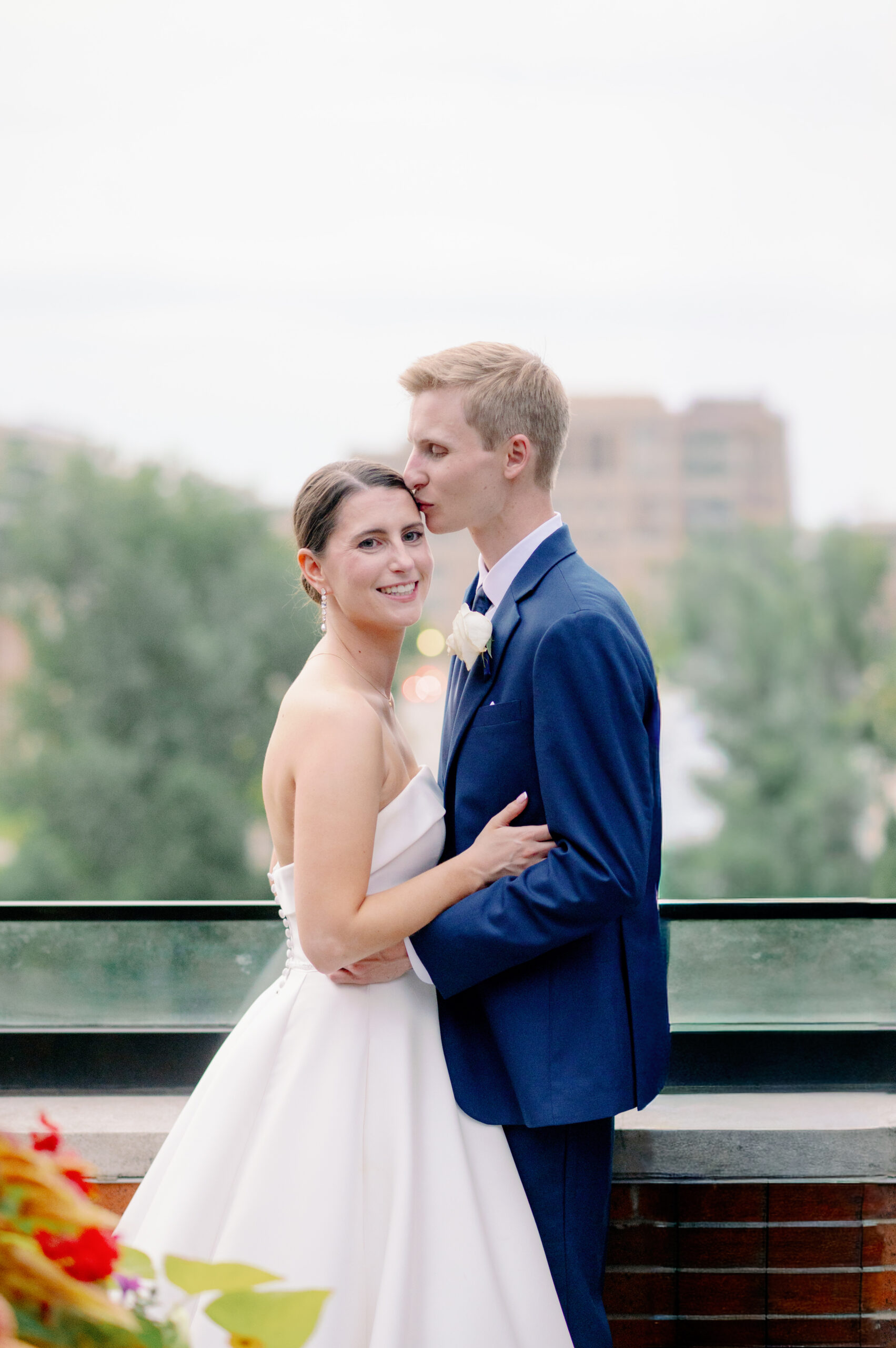 A bride and groom embrace at their Notre Dame wedding