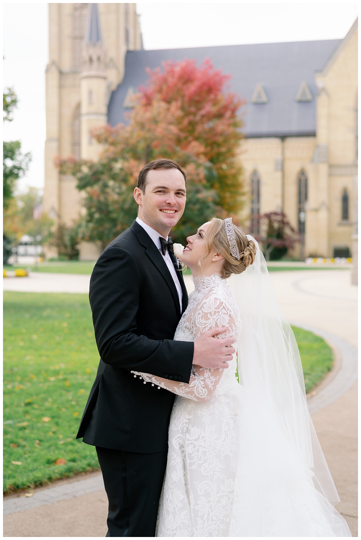 A bride smiles at her groom on their Notre Dame wedding day