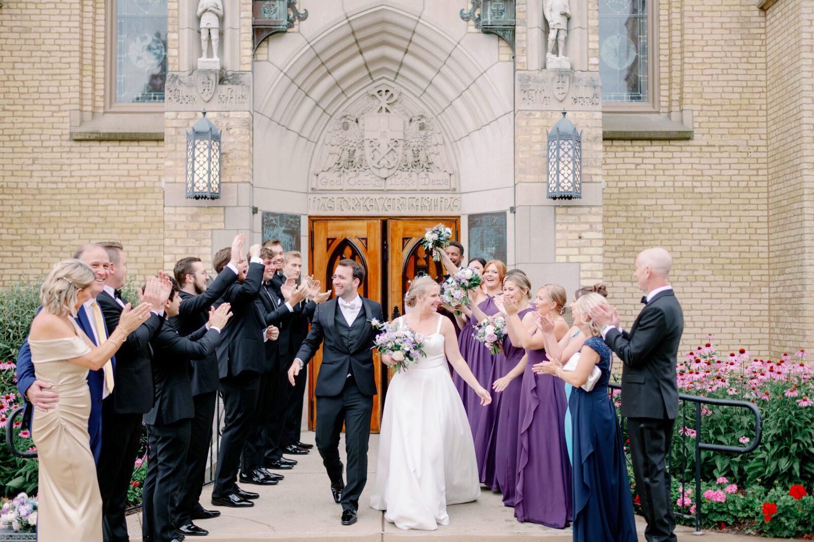 A couple exits from their ceremony in one of the best places to take wedding photos in South Bend