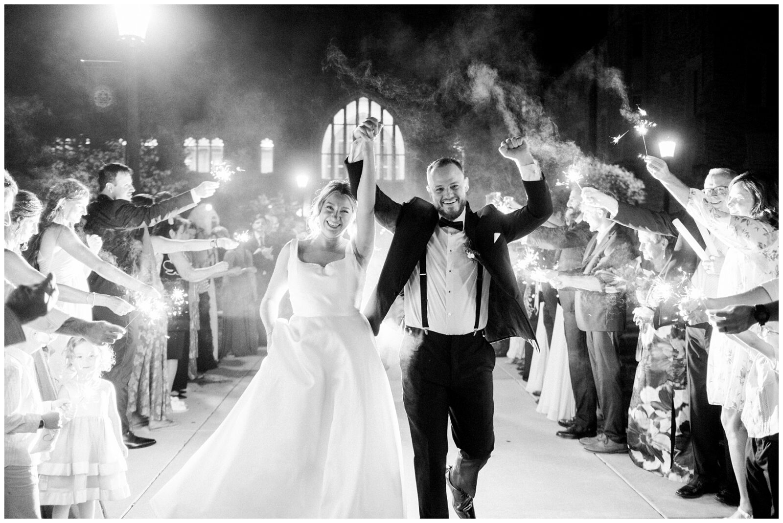 Bride and groom celebrating sparkler exit at Notre Dame wedding reception