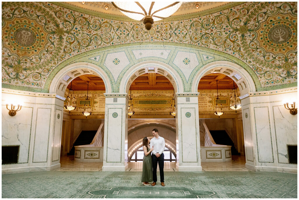 Engagement Photo Couple Standing in Front of the archway at the Chicago Cultural Center 