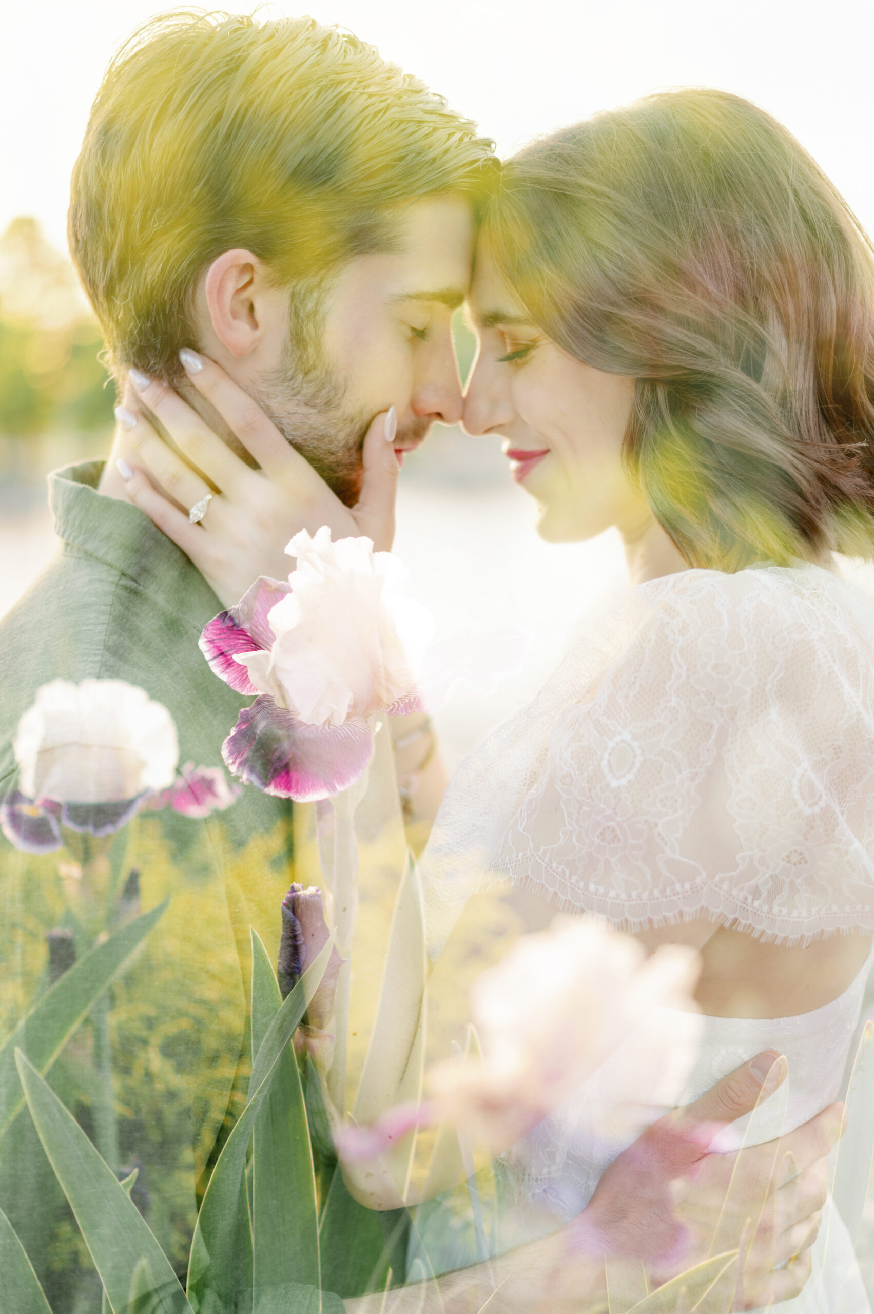 Couple embracing at Forest Park in St. Louis with a double exposure of purple irises