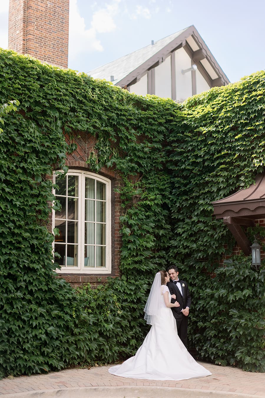 Bride and Groom in front of an ivy covered wall at Hinsdale Golf Club Wedding in Clarendon Hills, IL